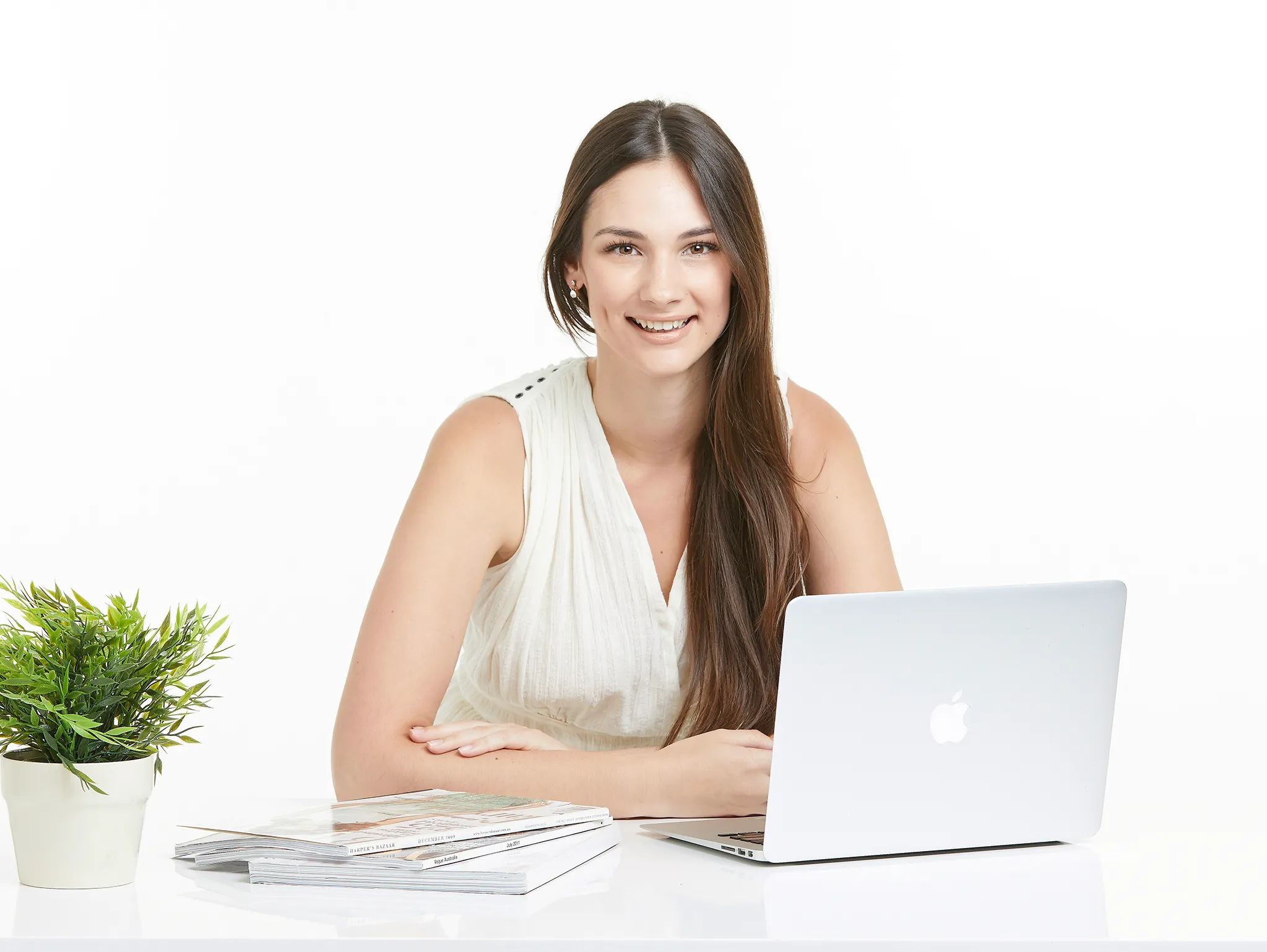woman at desk in studio posing for personal branding portraits