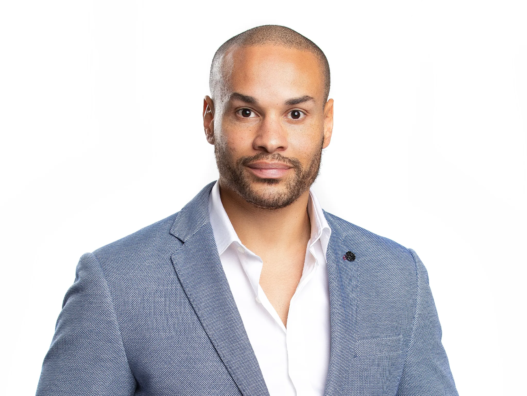 man in white studio posing for studio headshots